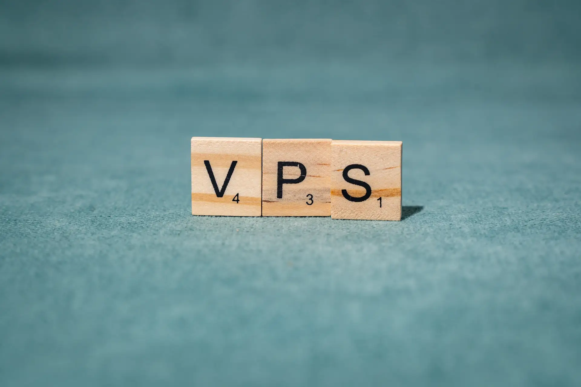 Wooden letters 'VPS' on green background